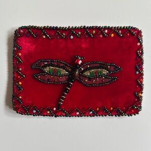 Red Beaded Dragonfly Change Purse measures 3 1/2” x 5”.